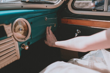 female hands in a retro car. Stylish old car. Retro