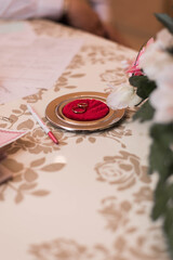Naklejka na ściany i meble wedding rings lie on a red plate. Wedding ceremony