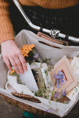 bicycle basket with decor. Flowers and postcards in a basket