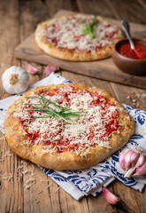 Classic Hungarian street food Langos, fried bread topped with ketchup, minced garlic and cheese