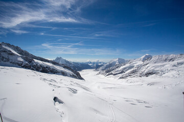 Fototapeta na wymiar a glacier between snow covered mountains