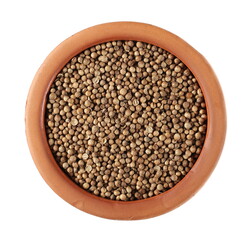 Coriander seeds in clay pot isolated on white background, top view 