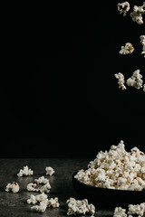 falling pop corn on black background