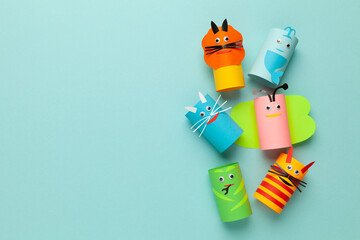 Homemade paper toys, creative kids art. Reuse toilet rolls, copy space for text.