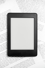 Electronic reader off on sheets of paper. Concepts: reading and technology