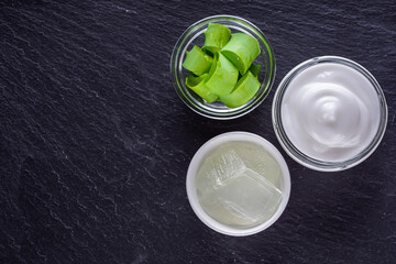 natural aloe vera cream on a dark stone background