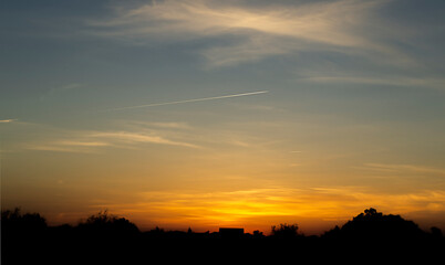 Fototapeta premium bright sunny sunset outside the city