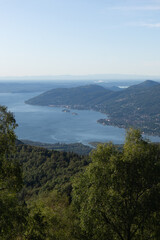 Lake maggiore and lake mergozzo seen from the mountains of val d'ossola during a summer day, near the town of Mergozzo, italy - September 2020.