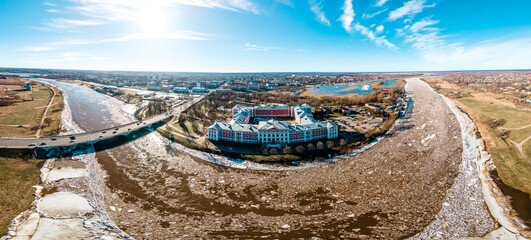 Panoramic view over city Jelgava (Mitava palace), Lielupe river and ''Latvia University of Agriculture'' during sunny spring day with ice pieces in river