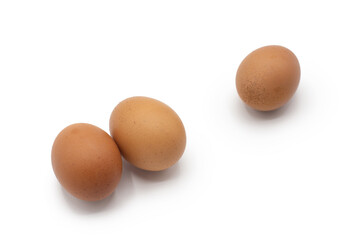 Three eggs together isolated on white background. Farm, Grocery, ecological healthy food concept. Selective focus in foreground