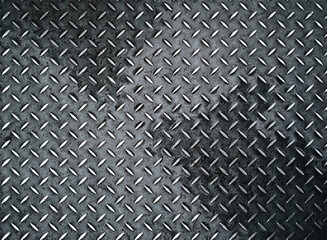 Vintage background of metal diamond plate in a gray silver color. Top view, copy space.