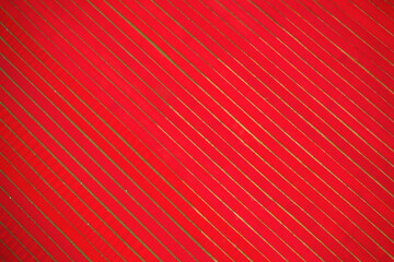Aerial view of agricultural fields used for drying hundreds of meters of red cotton fabric roll near Narsingdi, township, Dhaka, Bangladesh.