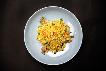 hot rice with pork on a black background