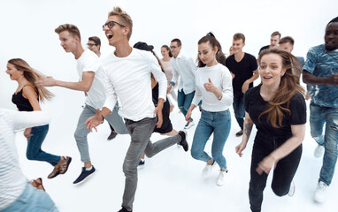 Obraz premium in full growth. a group of young people running forward