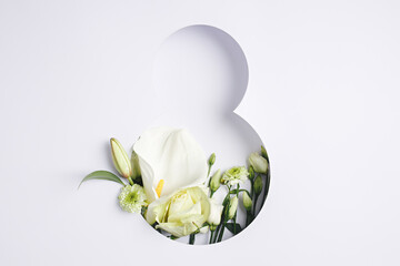 Number 8 with fresh gerbera, calla and rose flowers with green leaves on bright white background....