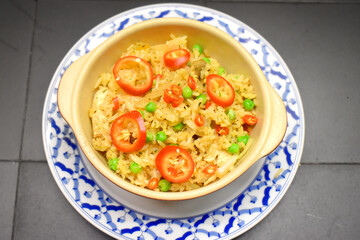 Chicken fried rice seasonings with mushrooms, green pea, red chilli. Spicy thai food style.