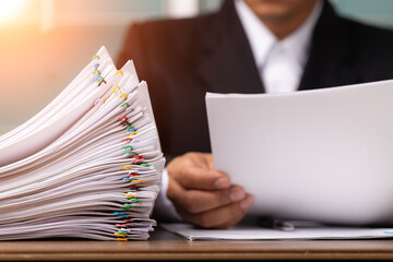 Business man or office workers with white shirt holding documents for writing