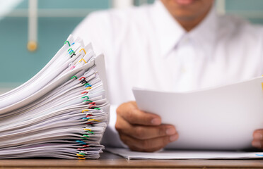 Business man or office workers with white shirt holding documents for writing