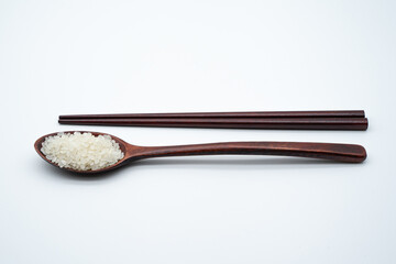 Concept image of grain using spoon and rice