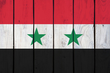 Syrian national flag on wooden texture