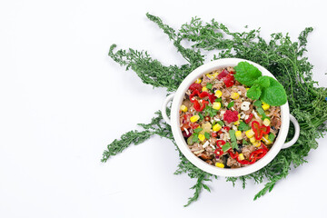 Mexican dish with tuna, corn and hot peppers with fresh mint