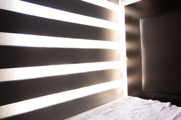 Fototapeta premium room with gray window blinds getting sunlight