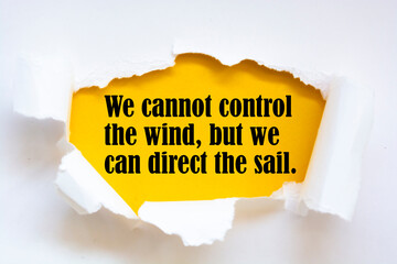 Inspirational motivational quote. We cannot control the wind, but we can direct the sail.