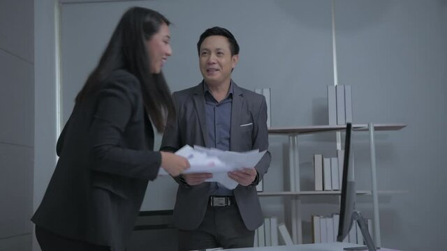 Business concept of 4k Resolution. Asian men and women rejoice in their success in the office.