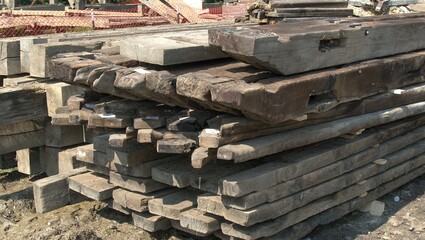 Pile of Old Timbers Being Tagged and Stored for Later Use