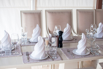 White banquet Table served for a party or a wedding celebration clean plates and napkins