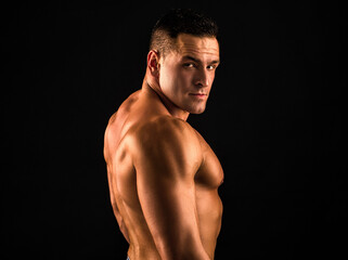 Fototapeta premium Naked man bare torso. Nude male abs. Sexy muscular guy. Topless muscular fitnes model. Sexy naked body.