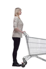 blond woman with a shopping cart looking ahead .