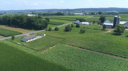 Fototapeta na wymiar Aerial View of an Amish One Room School House in the Middle Of Amish Farmlands on a Sunny Day