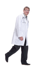 friendly doctor with a stethoscope striding forward .