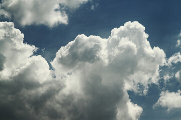 A cloud is an aerosol consisting of a visible mass of minute liquid droplets, frozen crystals or other particles suspended in the atmosphere