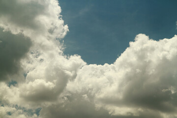 A cloud is an aerosol consisting of a visible mass of minute liquid droplets, frozen crystals or other particles suspended in the atmosphere