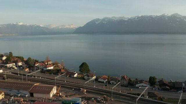 Aerial of highway at the edge of beautiful lake