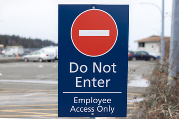 View of Sign Do Not Enter Employee Access Only on a Parking Lot at BC Ferries Little River Terminal