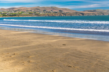Small waves lapping on the sand of Doran Beach, Bodega Bay Regional Park, California.