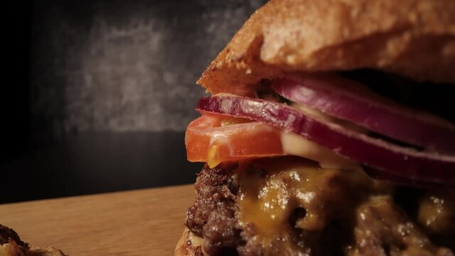 Extreme close-up of a fresh made burger - Chesseburger - food photography
