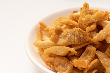 Fresh fried pork dregs on a pure white background