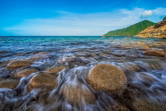 long exposure picture ,at Ao Hin Ngam bay rock beach, clear water beach, blue sky on summer , baan Chaloklum ,koh pha ngan ,Suratthani ,south of thailand