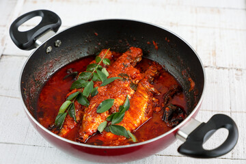 Spicy Mackerel fish curry gravy , cooking spicy Kerala fish curry , Goan red fish curry , Indian fish curry Bengali fish masala curry Kolkata, India Sri Lanka. Lankan food