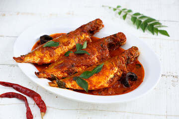Spicy Mackerel fish curry gravy , cooking spicy Kerala fish curry , Goan red fish curry , Indian fish curry Bengali fish masala curry Kolkata, India Sri Lanka. Lankan food