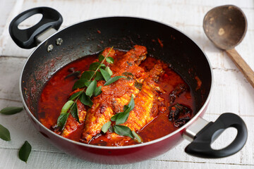 Spicy Mackerel fish curry gravy , cooking spicy Kerala fish curry , Goan red fish curry , Indian fish curry Bengali fish masala curry Kolkata, India Sri Lanka. Lankan food