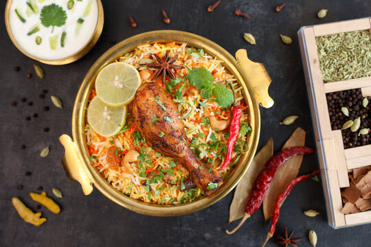 Chicken biryani Spicy Indian Malabar biryani Hyderabadi biryani, Dum Biriyani pulao golden bowl  Kerala India Sri Lanka Pakistan basmati rice mixed rice dish with meat curry Ramadan Kareem, Eid