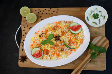 Vegetable biryani biriyani ,  Hyderabadi Shahi Pulao and raita Pilaf Basmati rice dish Indian spices Kerala India Sri Lanka Pakistan. Ghee rice, Lemon rice, boiled white rice