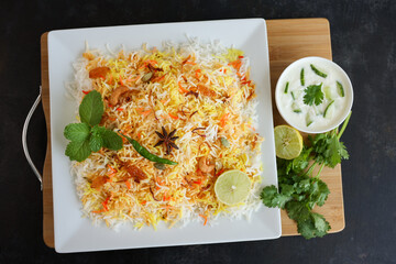 Vegetable biryani biriyani ,  Hyderabadi Shahi Pulao and raita Pilaf Basmati rice dish Indian spices Kerala India Sri Lanka Pakistan. Ghee rice, Lemon rice, boiled white rice