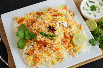 Vegetable biryani biriyani ,  Hyderabadi Shahi Pulao and raita Pilaf Basmati rice dish Indian spices Kerala India Sri Lanka Pakistan. Ghee rice, Lemon rice, boiled white rice