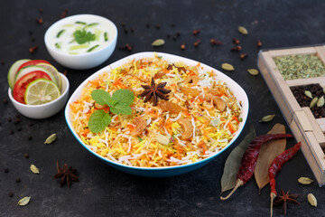 Vegetable biryani biriyani ,  Hyderabadi Shahi Pulao and raita Pilaf Basmati rice dish Indian spices Kerala India Sri Lanka Pakistan. Ghee rice, Lemon rice, boiled white rice